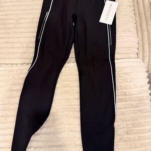 Athleta Black Leggings with White Piping and Zipper Pockets